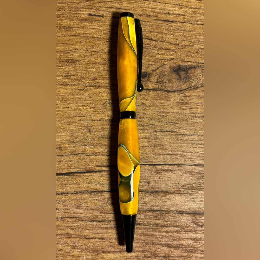 Beautiful hand turned acrylic ink pen. Smooth writing black ink. Black accents.